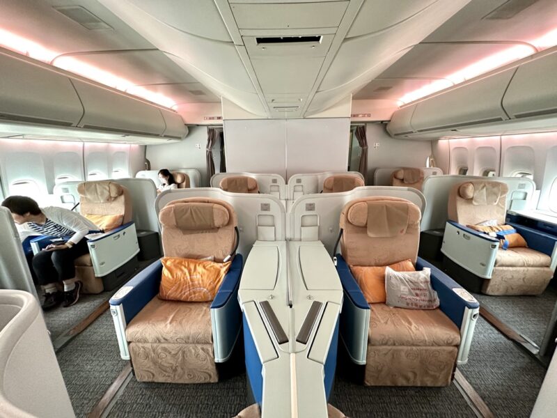 a plane with seats and a person sitting on it