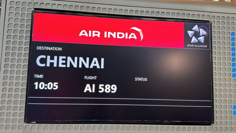 a sign with a red and white text