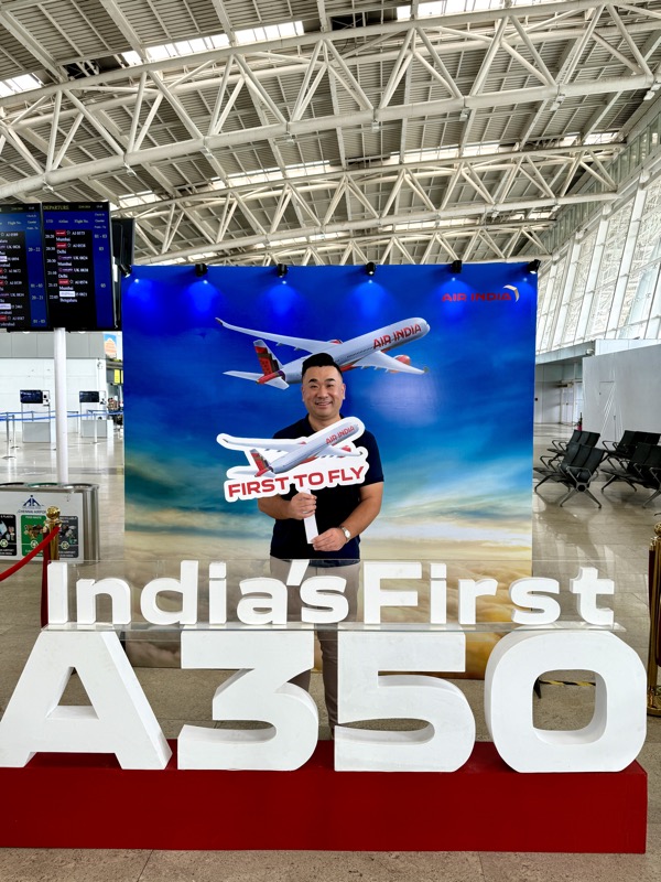 a man standing in front of a sign