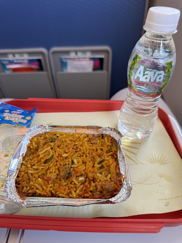 a tray of food and a bottle of water