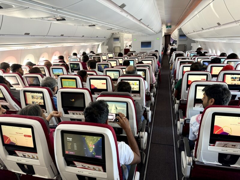 a group of people sitting in an airplane