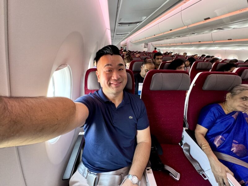 a man taking a selfie in an airplane