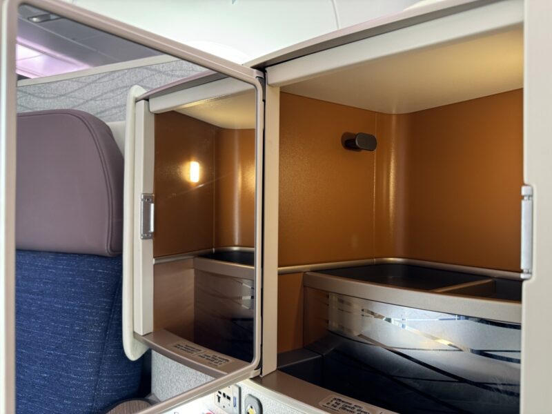 an empty seat with a door open