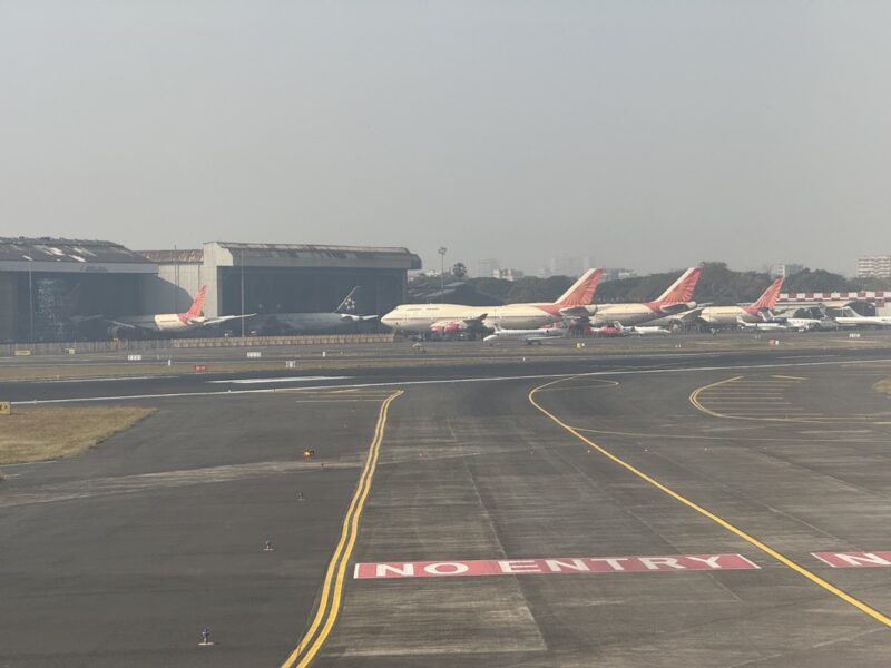 a runway with airplanes on it