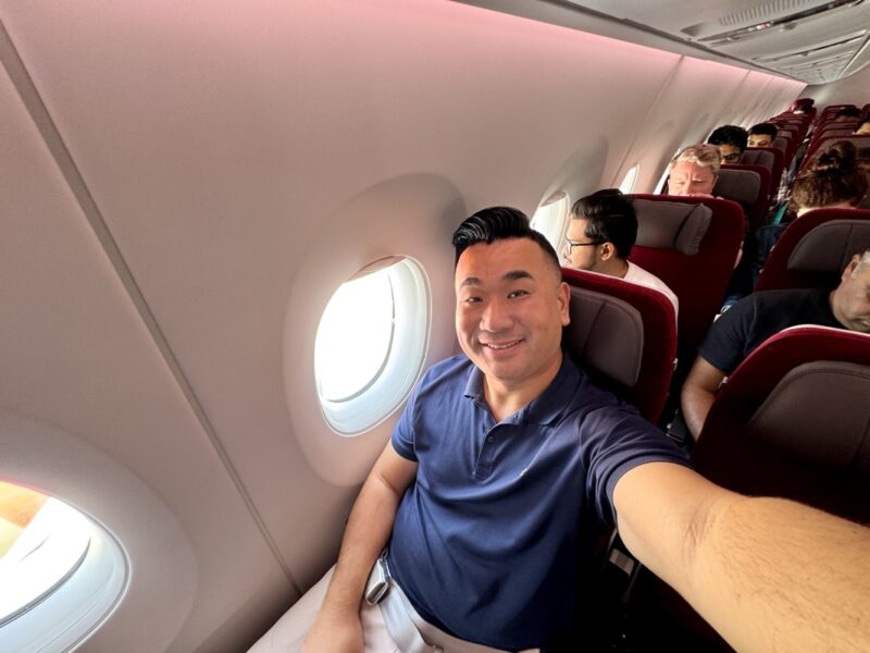 a man taking a selfie in an airplane