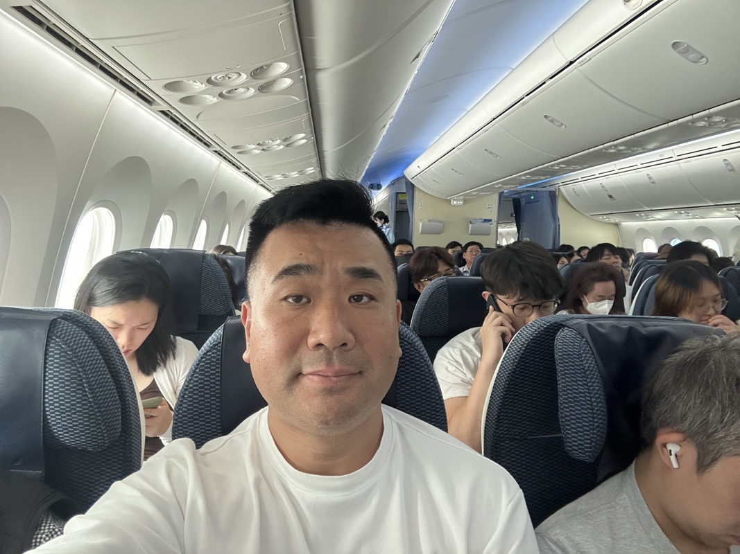 a man taking a selfie in an airplane