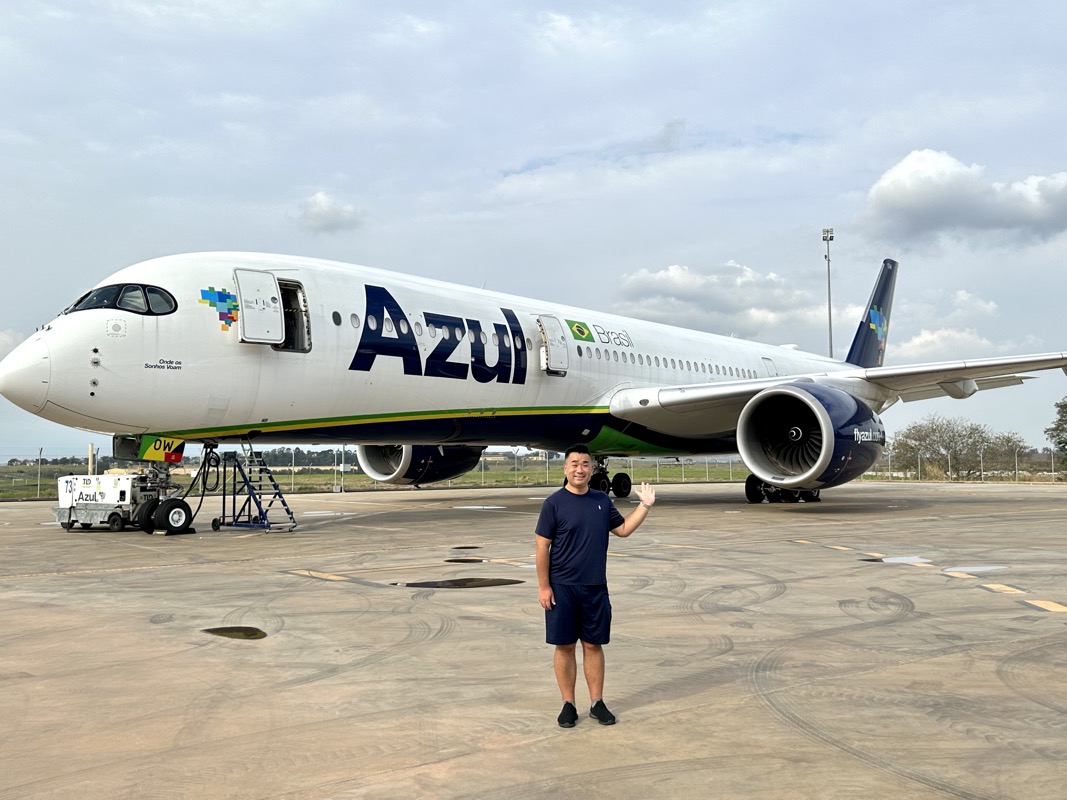 a man standing in front of an airplane
