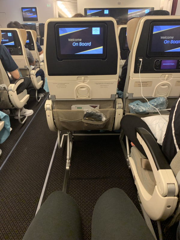 a group of seats with screens on them