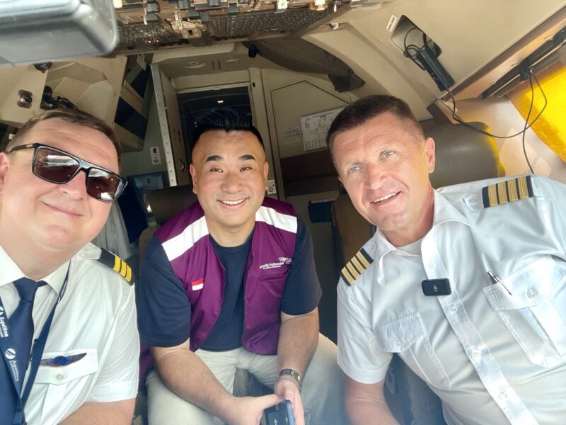 a group of men in uniform sitting in a plane