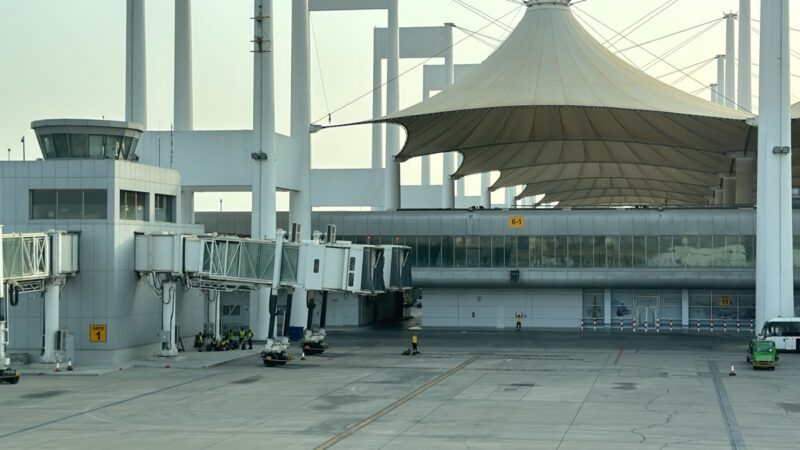 a large white structure with a white roof