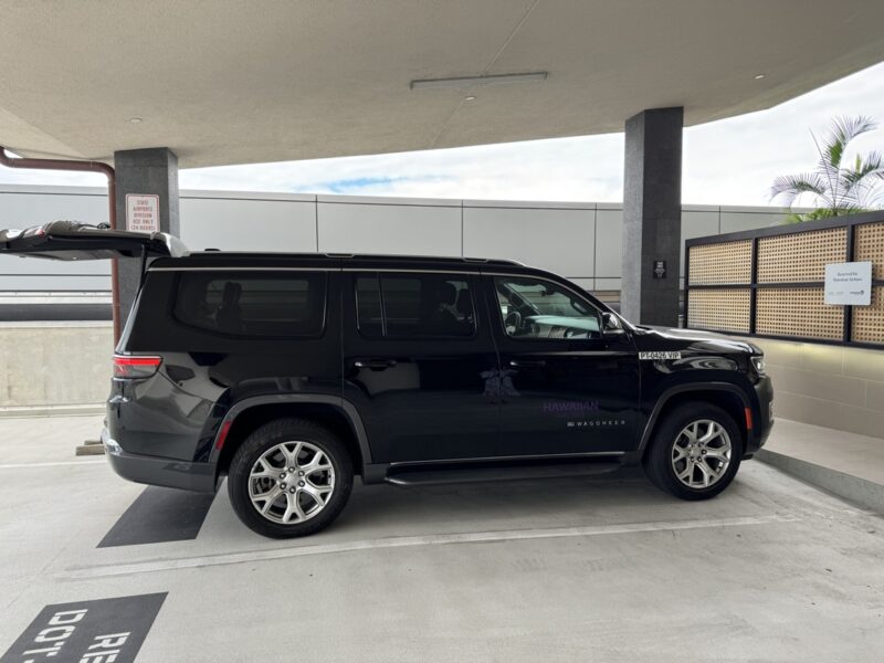 a black suv parked in a parking lot