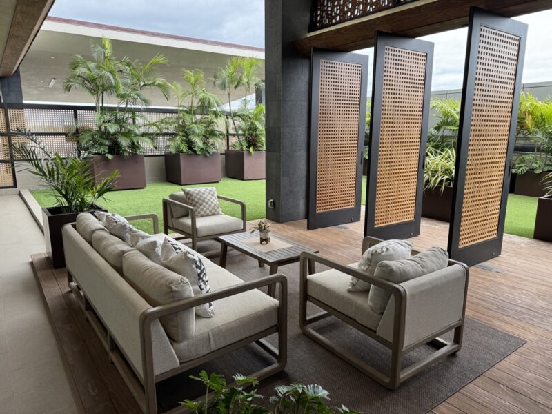 a patio area with chairs and tables