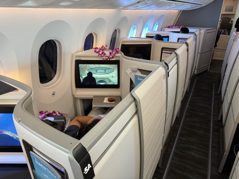 a person sleeping on a plane