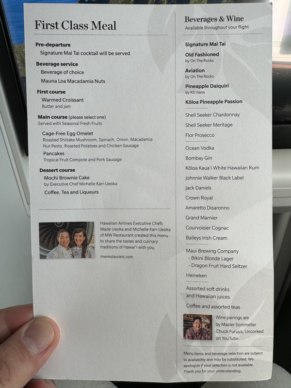 a hand holding a menu