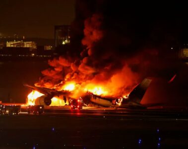 a plane on fire at night