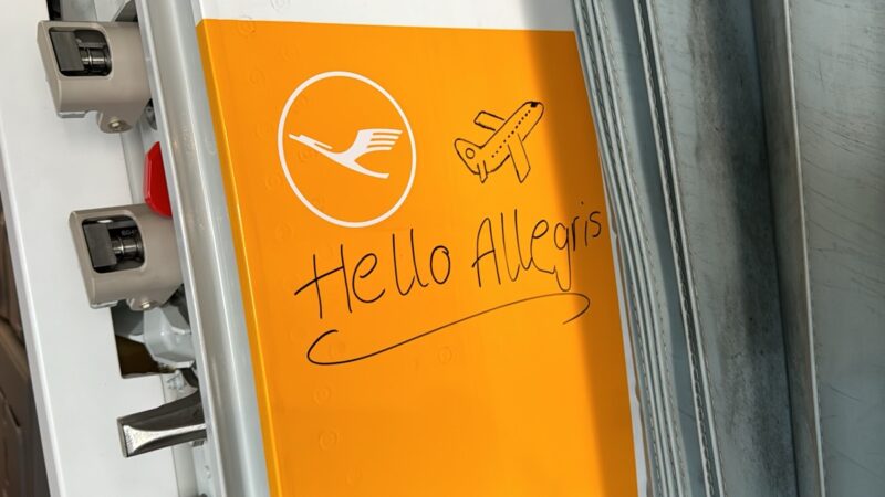 a yellow sign with a drawing on it