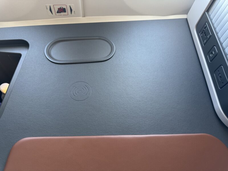 a black and brown surface with a black oval on it