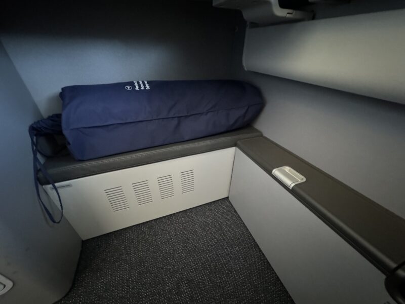 a blue pillow on a seat