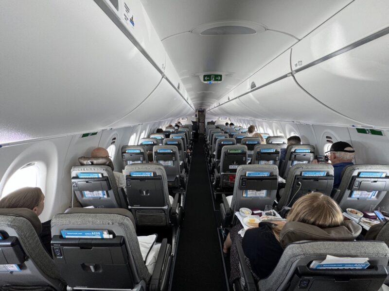 a group of people sitting in an airplane
