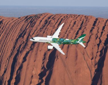 a plane flying over a mountain