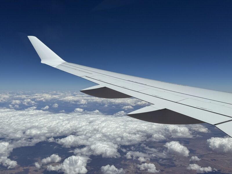 an airplane wing in the sky