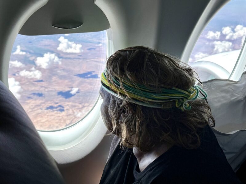 a person looking out of an airplane window