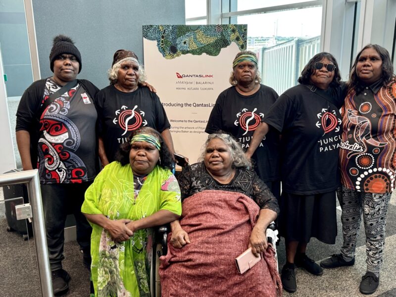 a group of women posing for a photo
