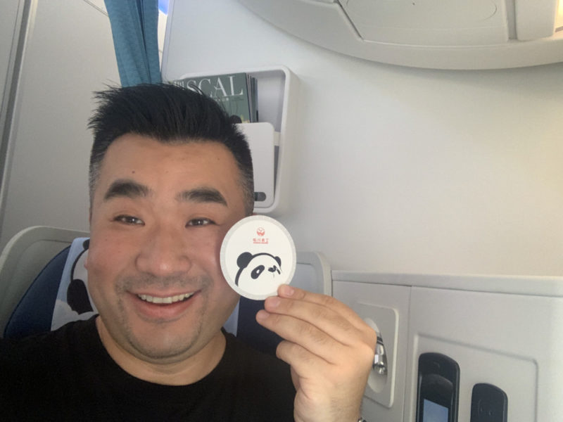 a man holding a small round object