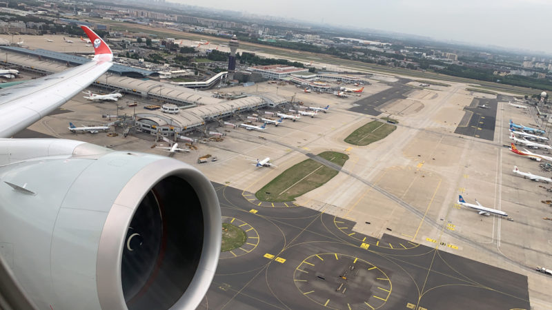 an airplane wing and a runway