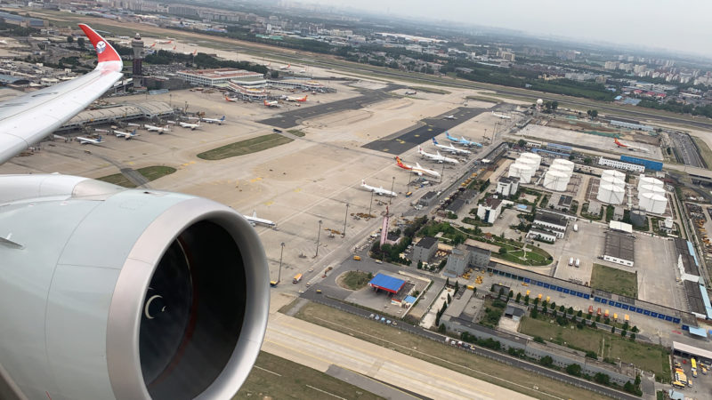 an airplane wing and a runway
