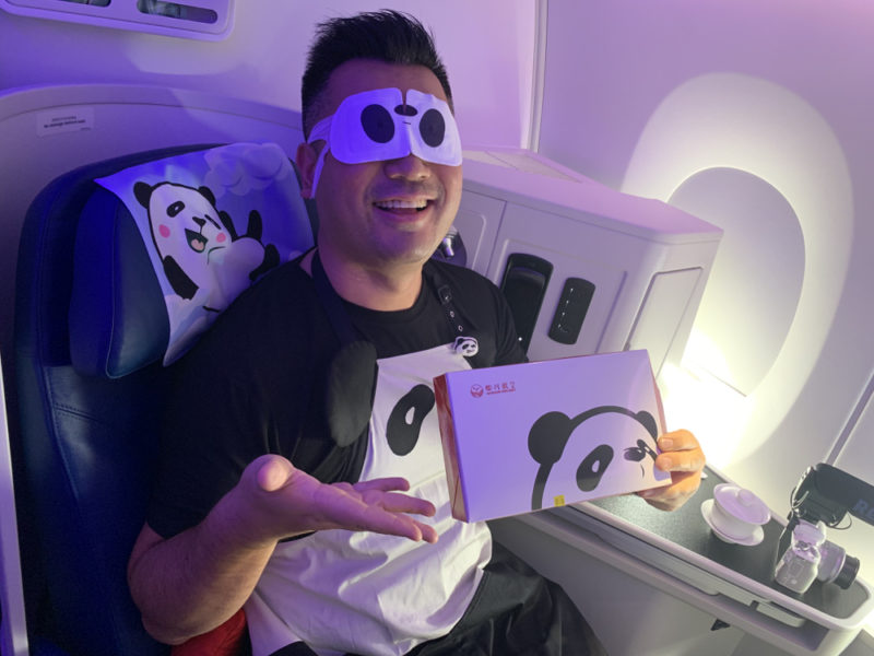 a man wearing a mask and holding a box