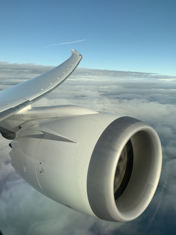 an airplane wing and the sky