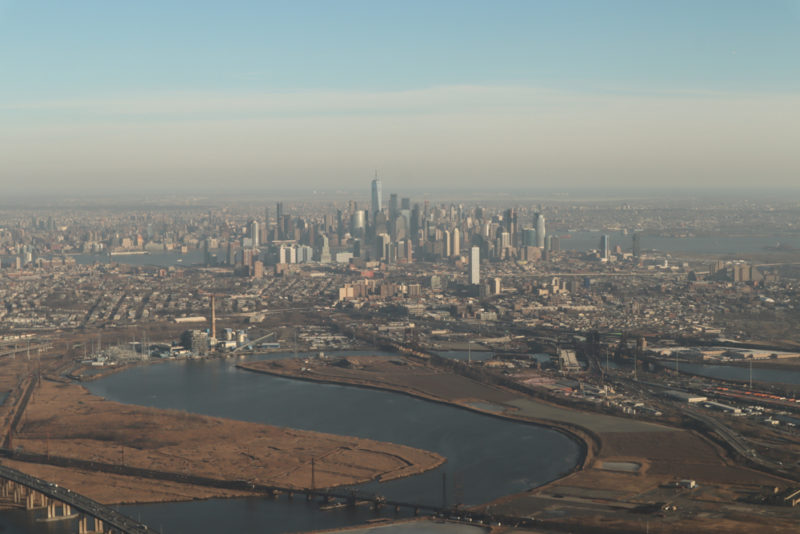 a city with a river and a city in the distance