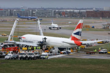 a group of airplanes at an airport